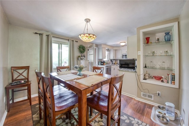5215 Caste Dr, Whitehall, PA 15236 - dining space with dark wood-style flooring and baseboards