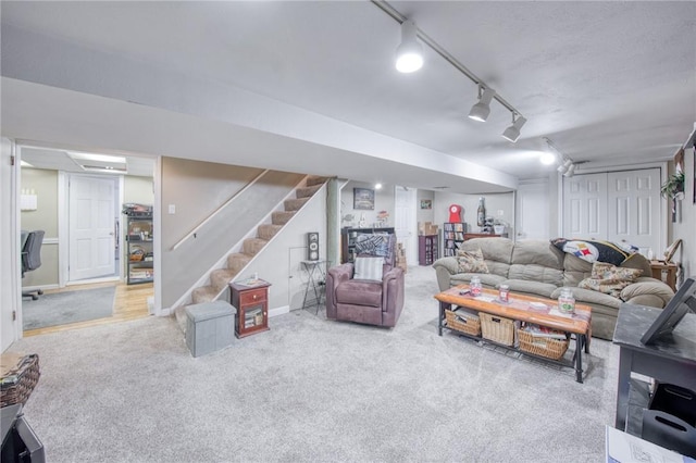 5215 Caste Dr, Whitehall, PA 15236 - living room with stairway, carpet floors, and track lighting