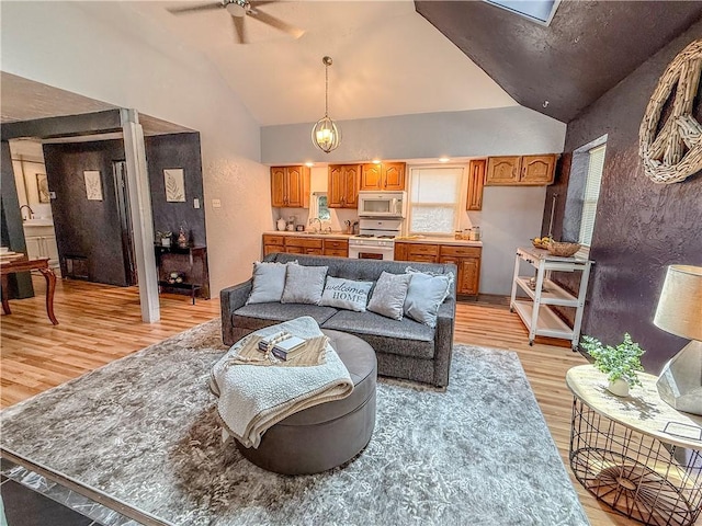 808 Thompson Run Rd, Springdale Twp, PA 15049 - living area with light wood-style floors, vaulted ceiling, and ceiling fan