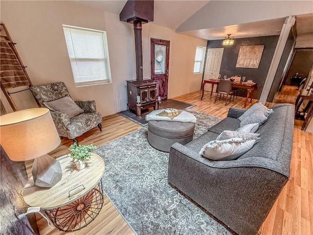 808 Thompson Run Rd, Springdale Twp, PA 15049 - living area featuring a wood stove, wood finished floors, and lofted ceiling