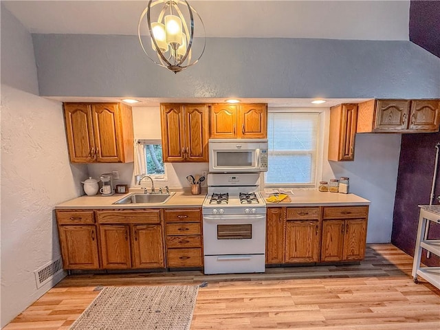 808 Thompson Run Rd, Springdale Twp, PA 15049 - kitchen featuring gas range gas stove, brown cabinets, a textured wall, light wood-style flooring, and light countertops