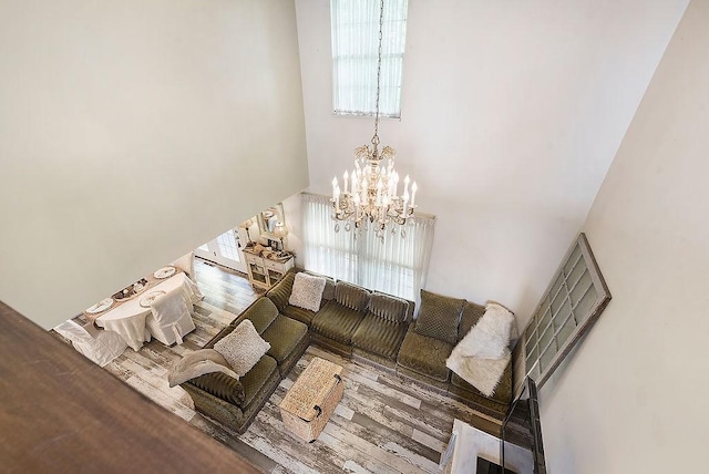 1115 Valleyview Dr, Cecil, PA 15055 - living room featuring a high ceiling, a chandelier, and wood finished floors