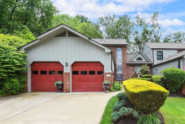 1115 Valleyview Dr, Cecil, PA 15055 - view of front of home with brick siding, concrete driveway, board and batten siding, and a garage