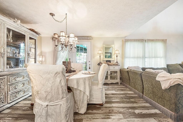 1115 Valleyview Dr, Cecil, PA 15055 - dining space featuring hardwood / wood-style flooring, a chandelier, and a textured ceiling