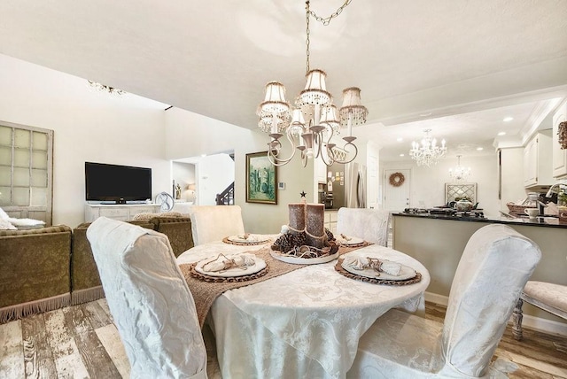 1115 Valleyview Dr, Cecil, PA 15055 - dining space featuring a chandelier, light wood-style flooring, recessed lighting, and stairs