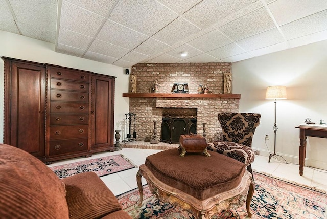 1115 Valleyview Dr, Cecil, PA 15055 - living room with light tile patterned floors, a paneled ceiling, and a brick fireplace