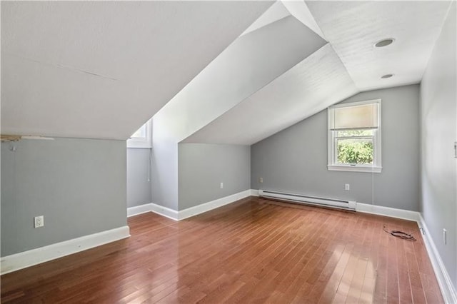 2617-2619 Spring Garden Ave, Spring Garden, PA 15212 - additional living space with baseboard heating, vaulted ceiling, and hardwood / wood-style flooring