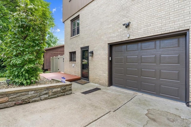 2912 Vinton, Sheraden, PA 15204 - view of side of property featuring brick siding, a garage, and driveway