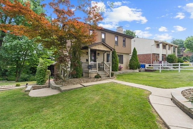 2912 Vinton, Sheraden, PA 15204 - view of front facade featuring a chimney, brick siding, and a porch