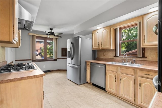 2912 Vinton, Sheraden, PA 15204 - kitchen featuring appliances with stainless steel finishes, light brown cabinetry, a ceiling fan, backsplash, and light countertops