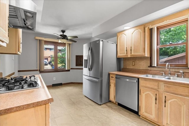 2912 Vinton, Sheraden, PA 15204 - kitchen featuring stainless steel appliances, light brown cabinetry, extractor fan, and healthy amount of natural light