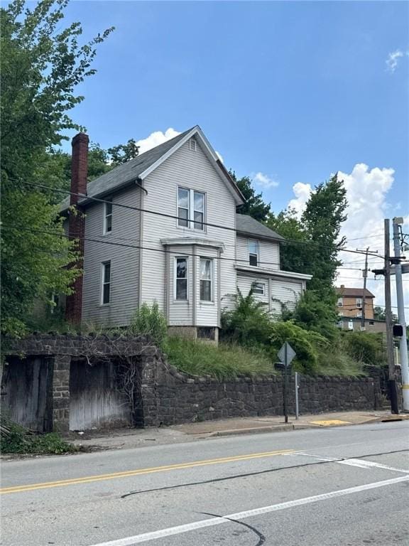 5015 Walnut St, Versailles Boro, PA 15132 - view of side of home with a chimney