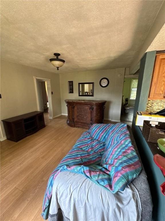 5015 Walnut St, Versailles Boro, PA 15132 - living room with a textured ceiling and light wood-style flooring