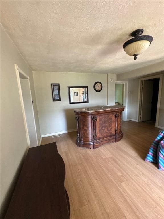 5015 Walnut St, Versailles Boro, PA 15132 - bar with a textured ceiling and wood finished floors