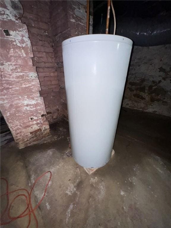 5015 Walnut St, Versailles Boro, PA 15132 - basement view of water heater and unfinished concrete floors