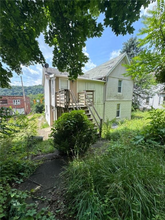5015 Walnut St, Versailles Boro, PA 15132 - rear view of property featuring stairway