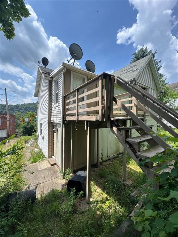 5015 Walnut St, Versailles Boro, PA 15132 - rear view of property with stairway and a wooden deck