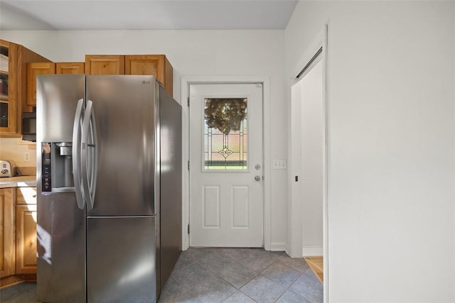 108 Republic Ave, Indiana Twp, PA 15051 - kitchen featuring stainless steel refrigerator with ice dispenser, brown cabinetry, light countertops, and light tile patterned floors