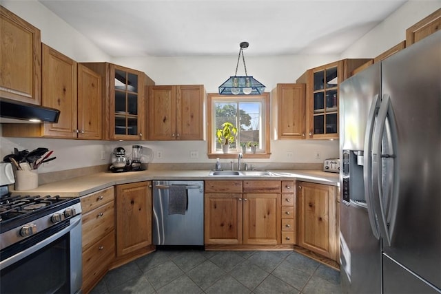 108 Republic Ave, Indiana Twp, PA 15051 - kitchen featuring appliances with stainless steel finishes, light countertops, brown cabinets, glass insert cabinets, and decorative light fixtures