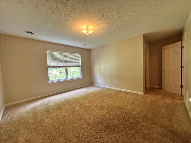 1009 Ironwood Cir, Jeannette, PA 15644 - empty room with light carpet and a textured ceiling