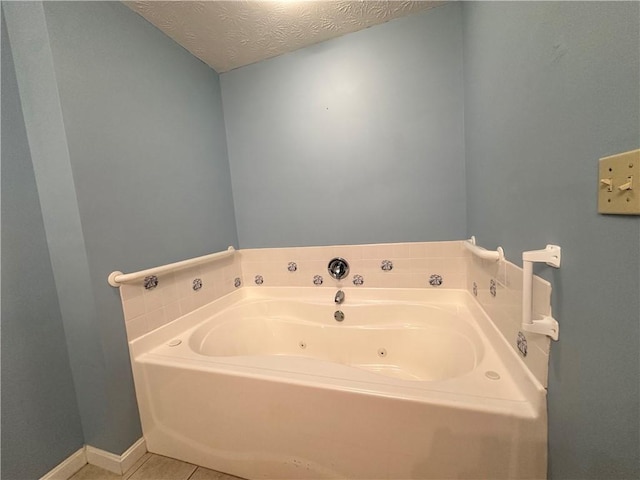 1009 Ironwood Cir, Jeannette, PA 15644 - full bath with a whirlpool tub, a textured ceiling, and tile patterned flooring