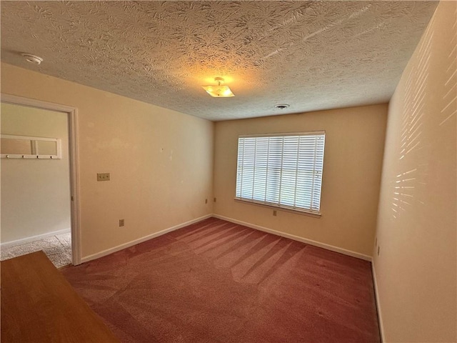1009 Ironwood Cir, Jeannette, PA 15644 - spare room with carpet floors, a smoke detector, and a textured ceiling