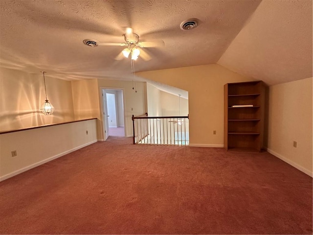 1009 Ironwood Cir, Jeannette, PA 15644 - carpeted empty room featuring ceiling fan, a textured ceiling, and vaulted ceiling