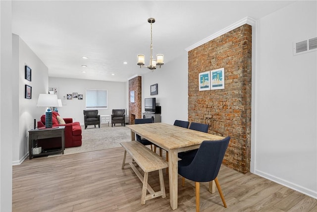 4536 Friendship Ave, Bloomfield, PA 15224 - dining area featuring light wood-style flooring, a chandelier, and recessed lighting