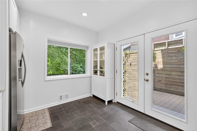 4536 Friendship Ave, Bloomfield, PA 15224 - doorway with plenty of natural light, french doors, recessed lighting, and dark stone finish floors