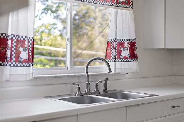 242 Millport Rd, West Mifflin, PA 15122 - kitchen with light countertops and white cabinetry