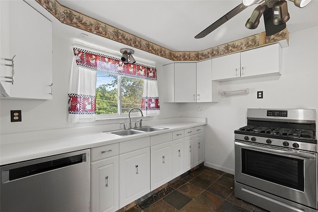 242 Millport Rd, West Mifflin, PA 15122 - kitchen featuring stainless steel appliances, dark stone finish flooring, white cabinets, and light countertops