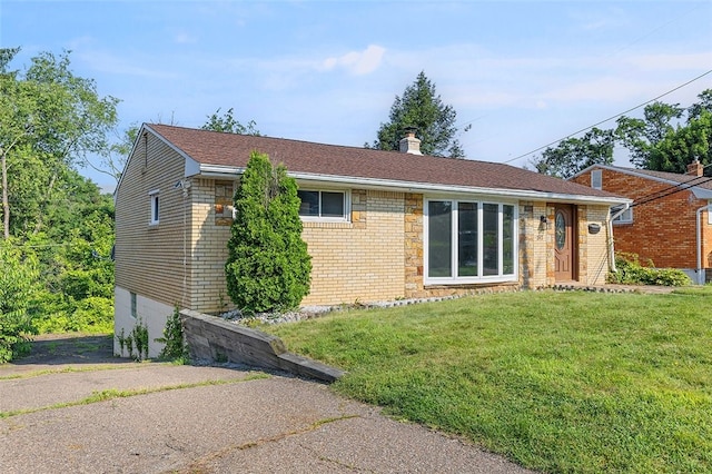 242 Millport Rd, West Mifflin, PA 15122 - ranch-style house featuring a front yard, a chimney, and brick siding