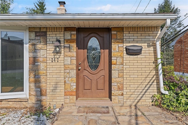 242 Millport Rd, West Mifflin, PA 15122 - property entrance with a chimney and brick siding