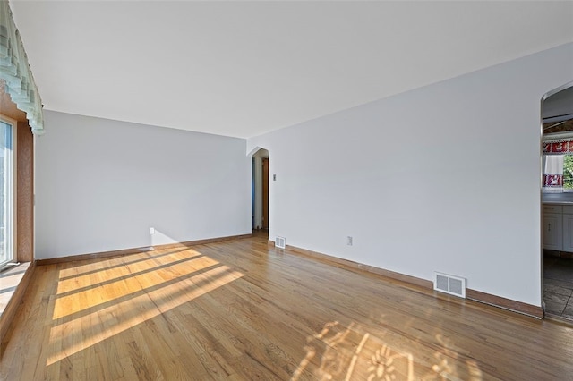 242 Millport Rd, West Mifflin, PA 15122 - unfurnished room featuring arched walkways and wood finished floors