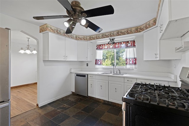 242 Millport Rd, West Mifflin, PA 15122 - kitchen featuring stainless steel appliances, white cabinetry, a chandelier, dark stone finish flooring, and light countertops