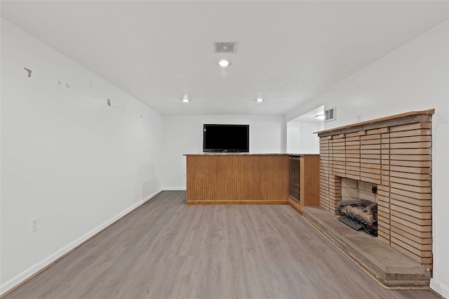 242 Millport Rd, West Mifflin, PA 15122 - unfurnished living room featuring a fireplace, light wood-type flooring, and recessed lighting