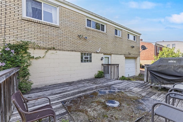 242 Millport Rd, West Mifflin, PA 15122 - back of house featuring a wooden deck, an attached garage, and brick siding
