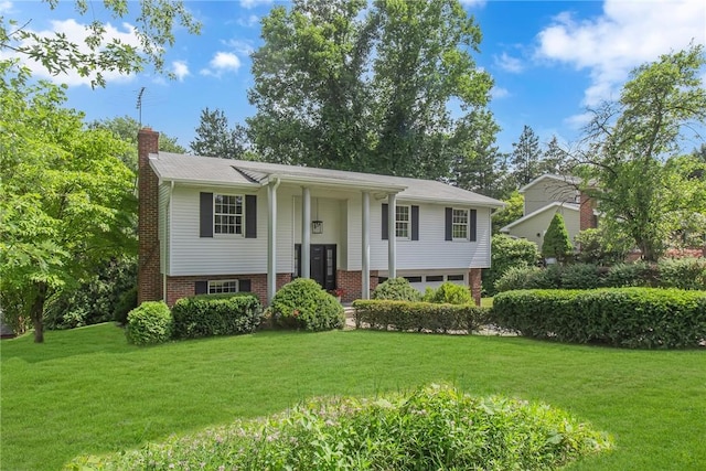 231 W Shaffer Rd, Center Twp, PA 15001 - split foyer home with a chimney, a front lawn, and brick siding