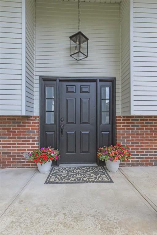 231 W Shaffer Rd, Center Twp, PA 15001 - doorway to property with brick siding