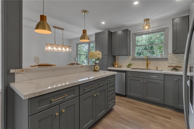 231 W Shaffer Rd, Center Twp, PA 15001 - kitchen with stainless steel appliances, gray cabinets, healthy amount of natural light, decorative backsplash, and recessed lighting