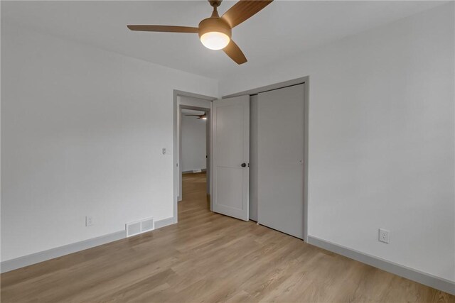231 W Shaffer Rd, Center Twp, PA 15001 - unfurnished bedroom featuring light wood-style floors, a closet, and ceiling fan