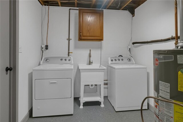 231 W Shaffer Rd, Center Twp, PA 15001 - washroom featuring gas water heater, washer and dryer, and cabinet space