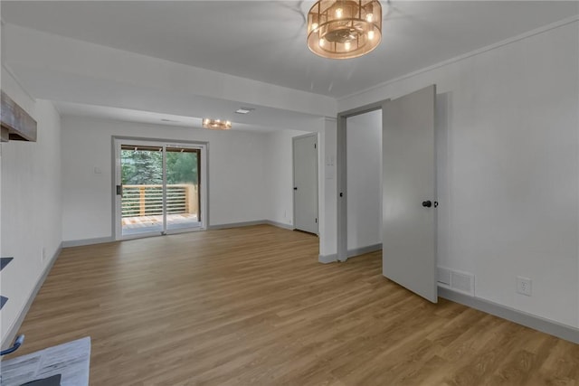 231 W Shaffer Rd, Center Twp, PA 15001 - spare room featuring light wood-style floors and a chandelier
