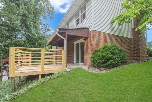 231 W Shaffer Rd, Center Twp, PA 15001 - view of property exterior with a yard, brick siding, and a deck