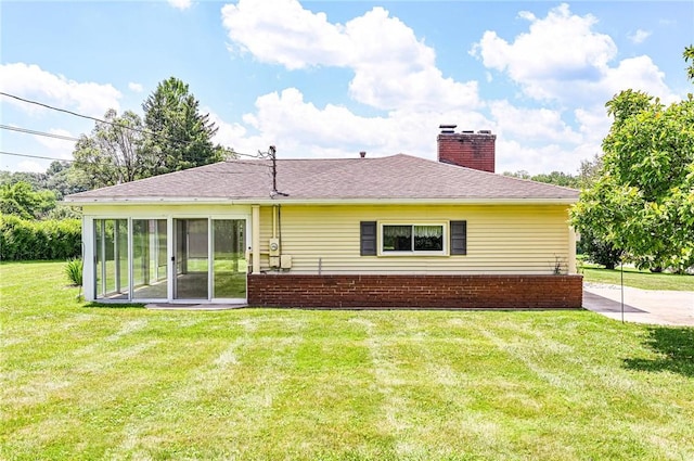 1515 George St, Unity Twp, PA 15650 - rear view of property featuring a chimney and a lawn