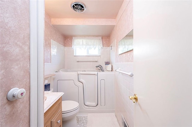 1515 George St, Unity Twp, PA 15650 - full bathroom with tile walls, a bathtub, vanity, and tile patterned flooring
