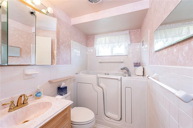 1515 George St, Unity Twp, PA 15650 - bathroom featuring tile walls, a bath, and vanity