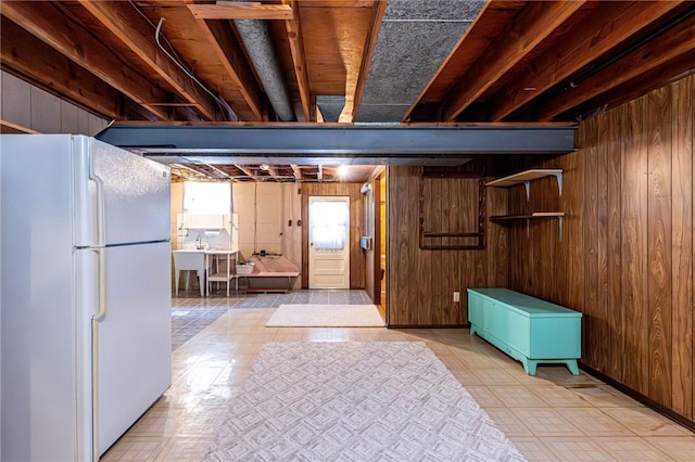 1515 George St, Unity Twp, PA 15650 - below grade area featuring freestanding refrigerator and wood walls