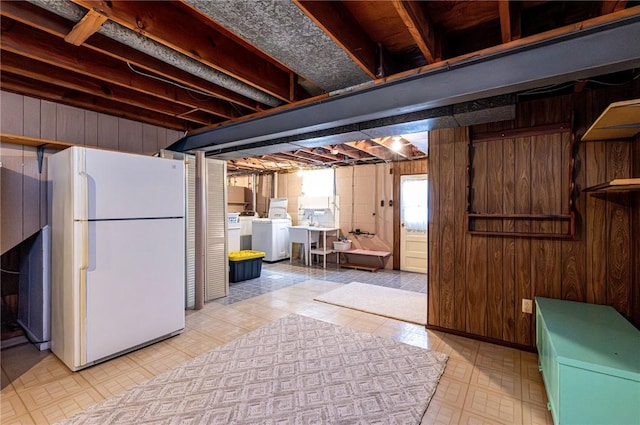 1515 George St, Unity Twp, PA 15650 - below grade area with freestanding refrigerator, wooden walls, independent washer and dryer, and tile patterned floors
