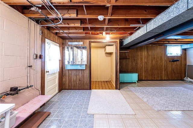 1515 George St, Unity Twp, PA 15650 - below grade area with wood walls, a wall mounted AC, and concrete block wall